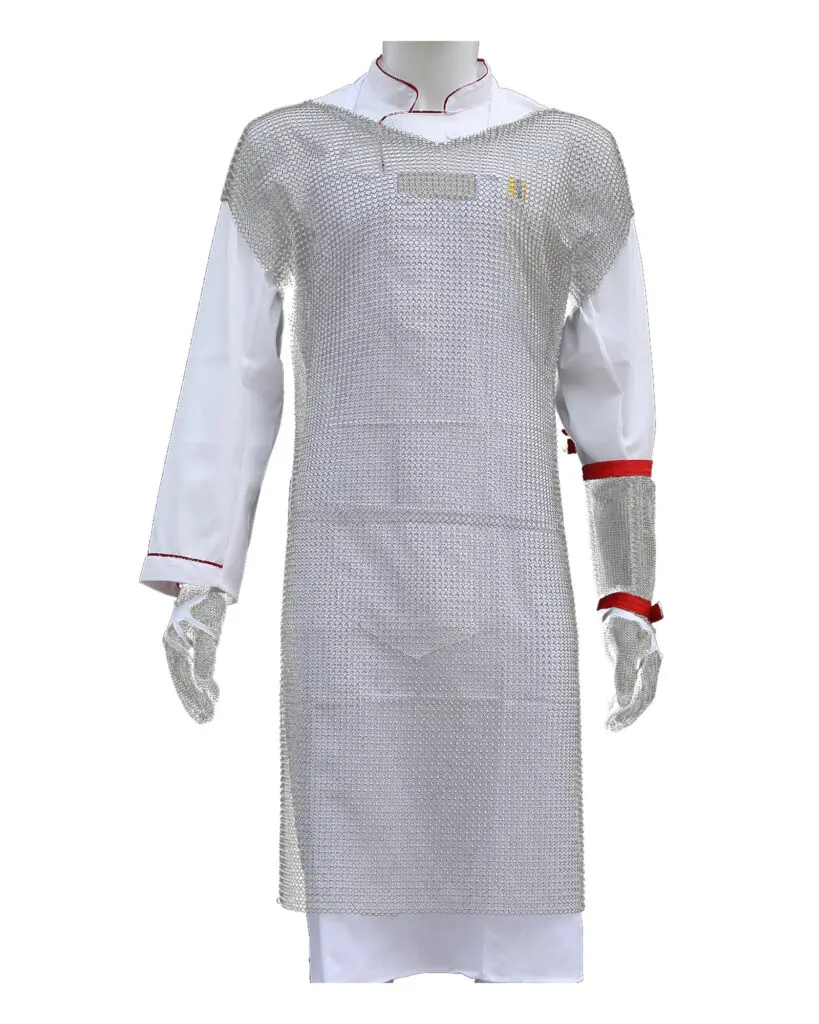 Steelora stainless steel mesh apron with shoulder protection worn over a white chef jacket